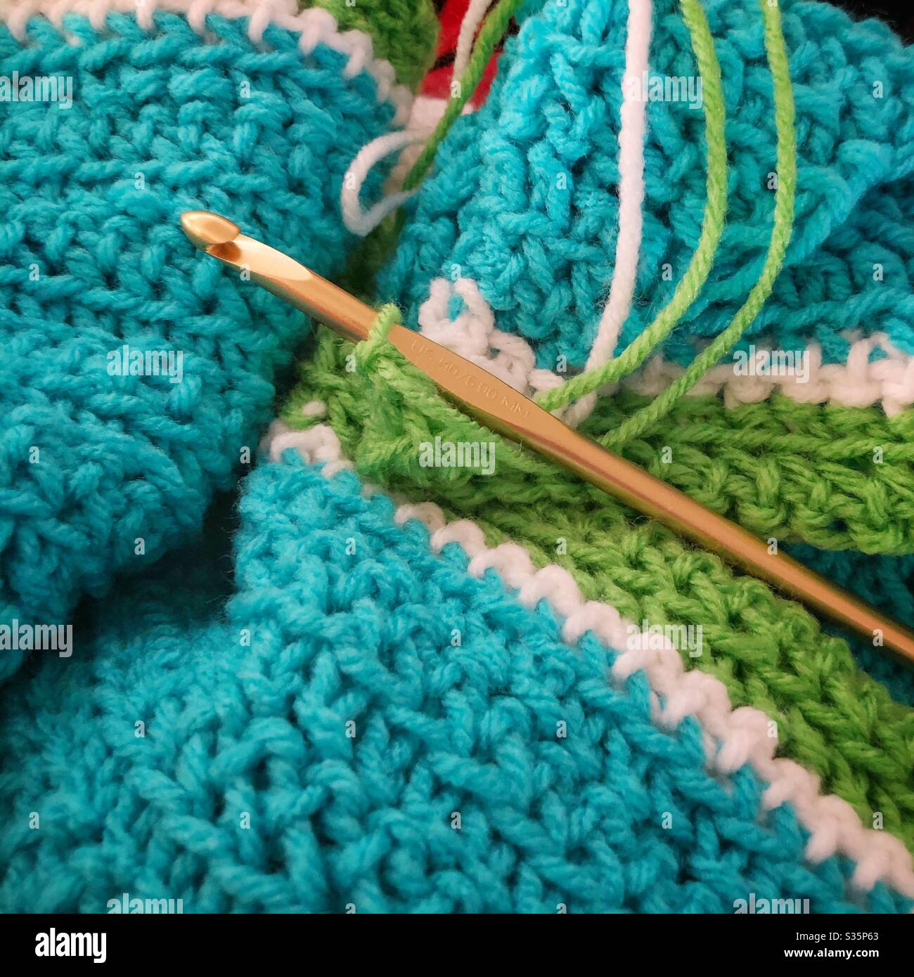 Crocheting an afghan. - Smartphone Captured Stock Image