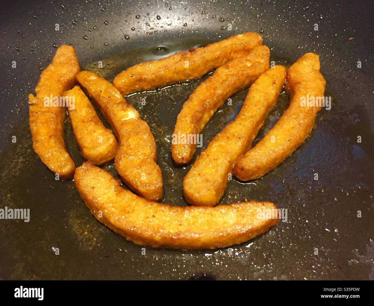 Halloumi fries in a frying pan Stock Photo Alamy