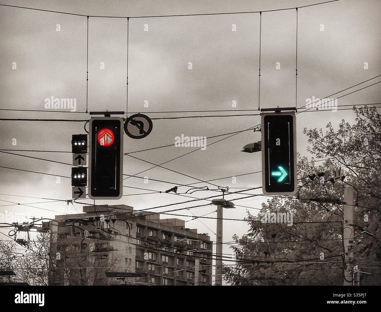 Red and green traffic lights in urban landscape - Smartphone Captured Stock Image