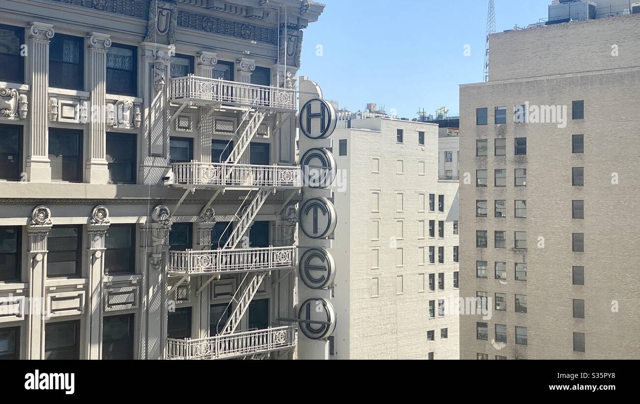 LOS ANGELES, CA, APR 2020: corner of Hotel Clark with exterior fire escape, and nearby apartment and office buildings, Downtown - Smartphone Captured Stock Image