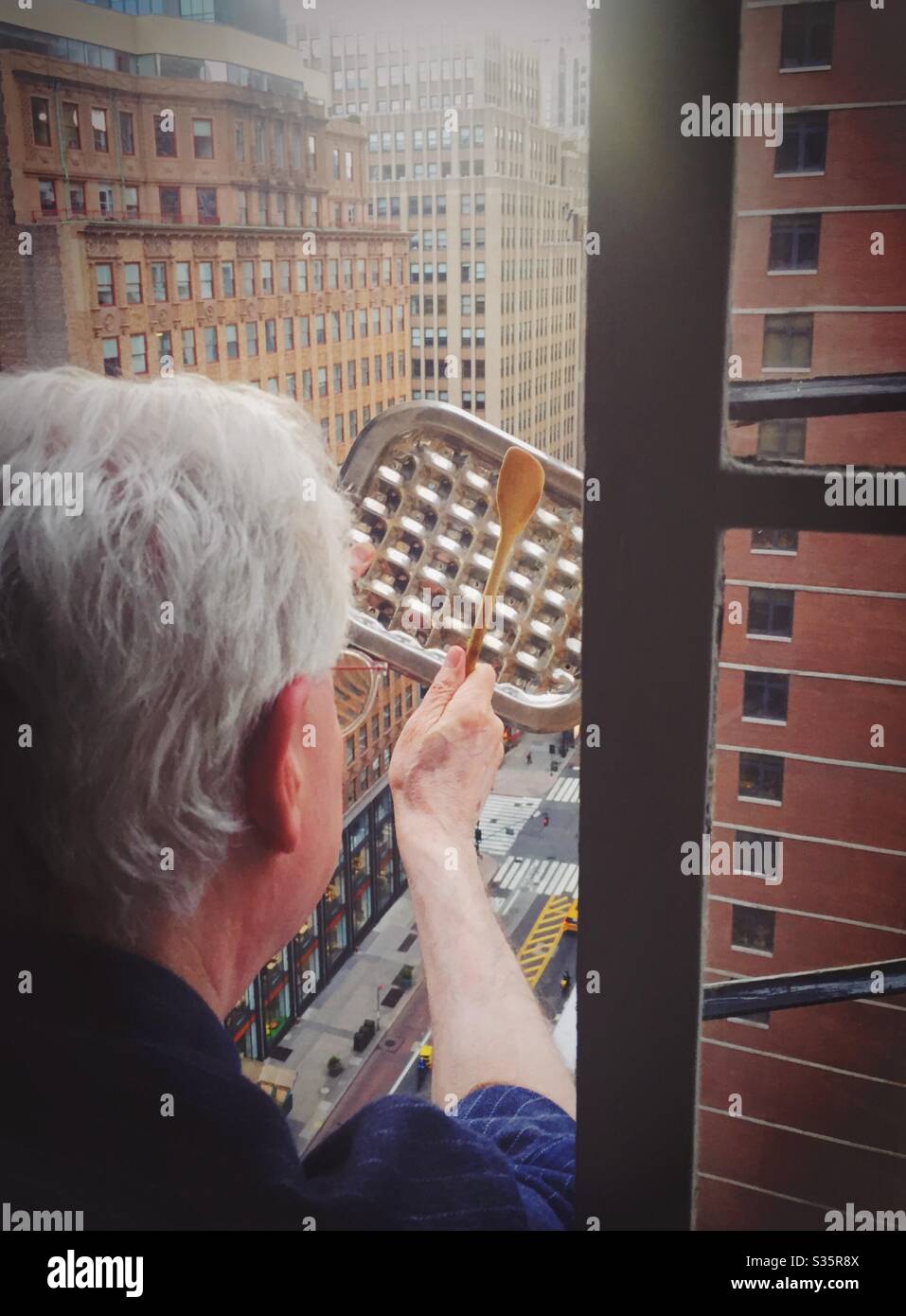 Every night at 7 o’clock New Yorkers salute the front line healthcare workers in their fight against COVID-19 and their heroic efforts to save lives, 2020, NYC, USA - Smartphone Captured Stock Image