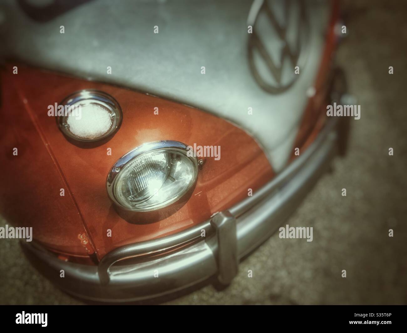 Front view of a two toned orange and white vintage Volkswagen Bus - Smartphone Captured Stock Image