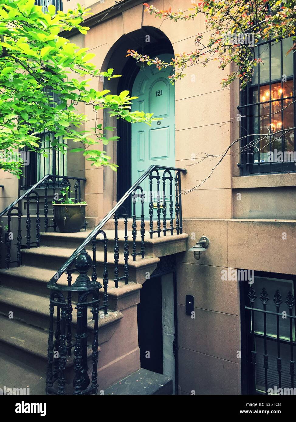 Well kept brownstones in the historic Murray Hill neighborhood feature rod iron railing’s in landscaped fronts, NYC, USA - Smartphone Captured Stock Image