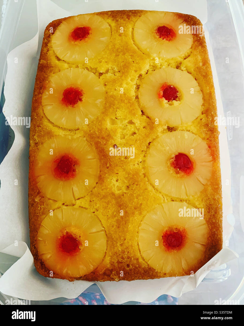 Homemade pineapple upside down cake. Pineapples and cherries. Stock Photo