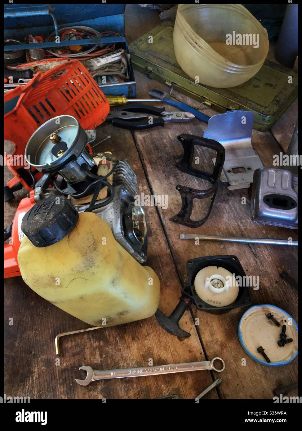 Rebuilding a brush-cutter two-stroke engine, Catalonia, Spain. Stock Photo