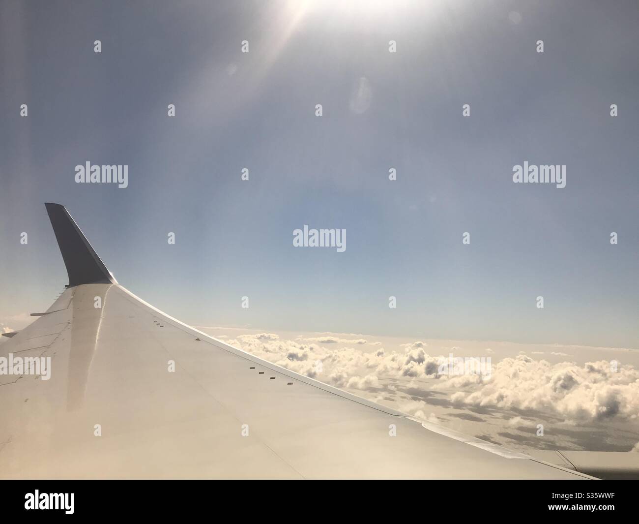 Airplane wing in the sun - Smartphone Captured Stock Image