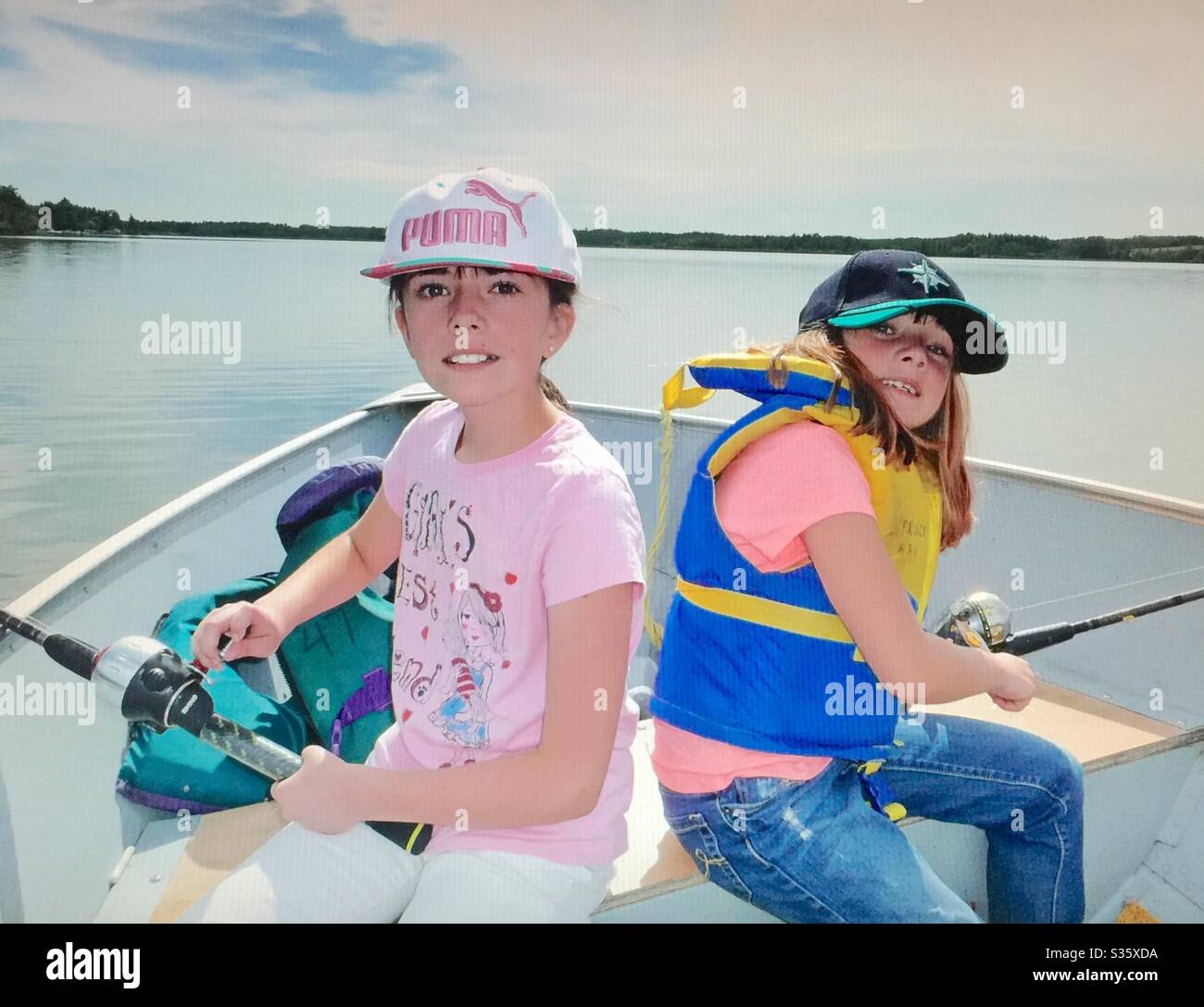 Family fun, Fishing on Pine Lake , Alberta, Canada. - Smartphone Captured Stock Image