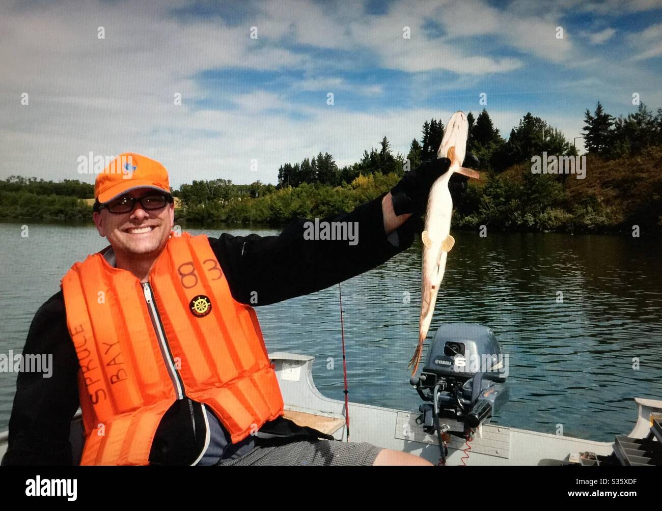 Family fun, Fishing on Pine Lake , Alberta, Canada, - Smartphone Captured Stock Image