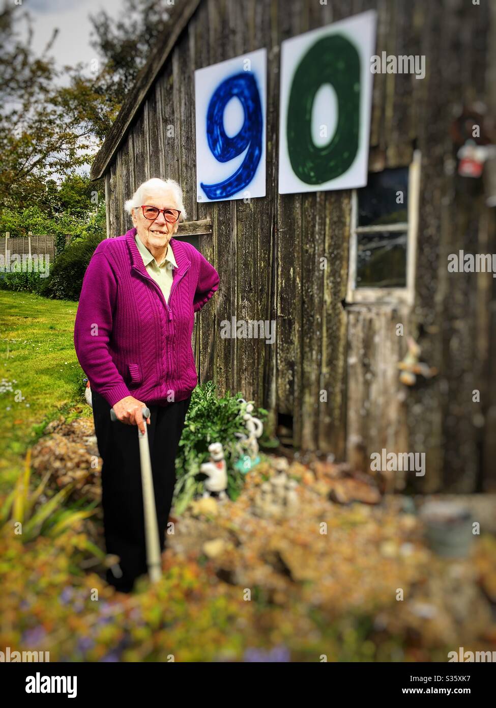 Lady celebrating her 90th birthday alone during Coronavirus lockdown 2020. - Smartphone Captured Stock Image