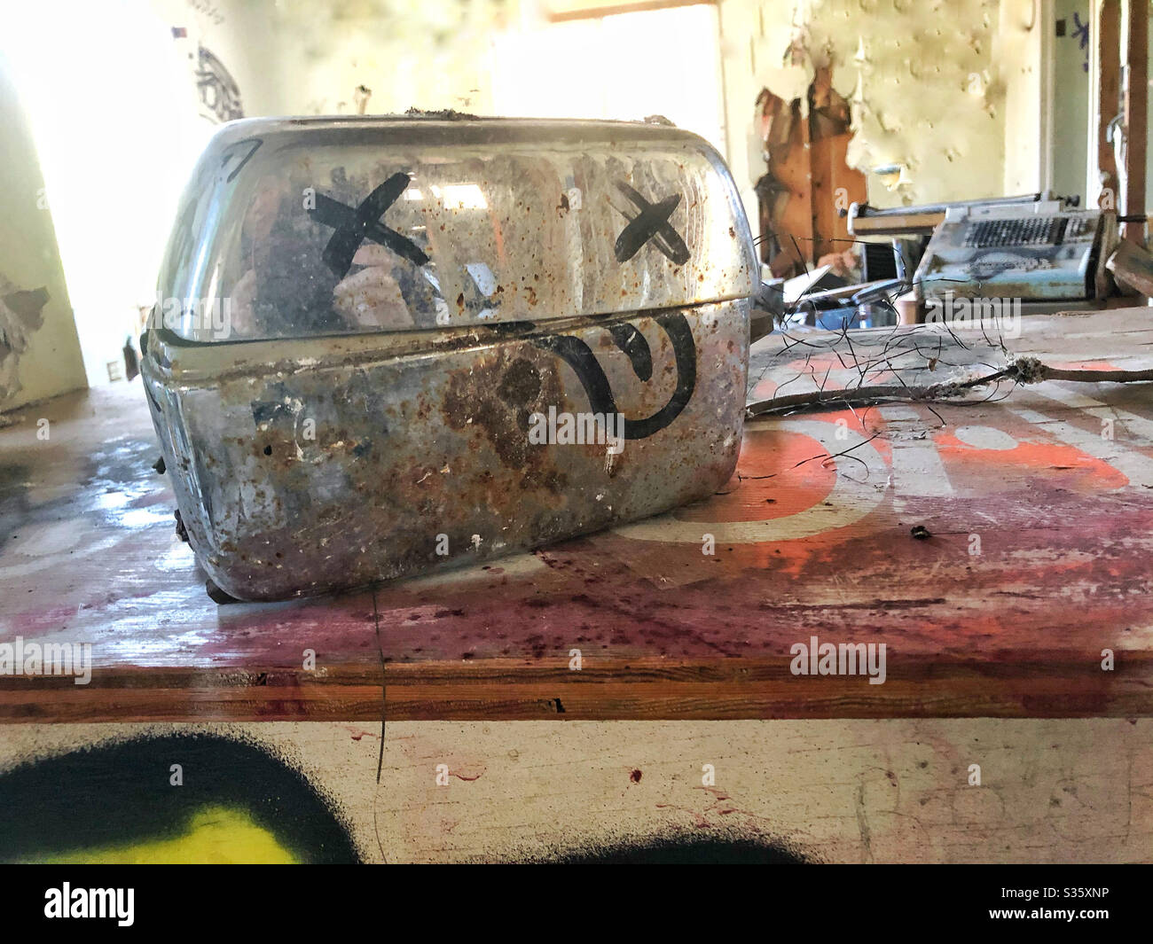 Broken toaster with graffiti face in abandoned house, USA Stock Photo Alamy