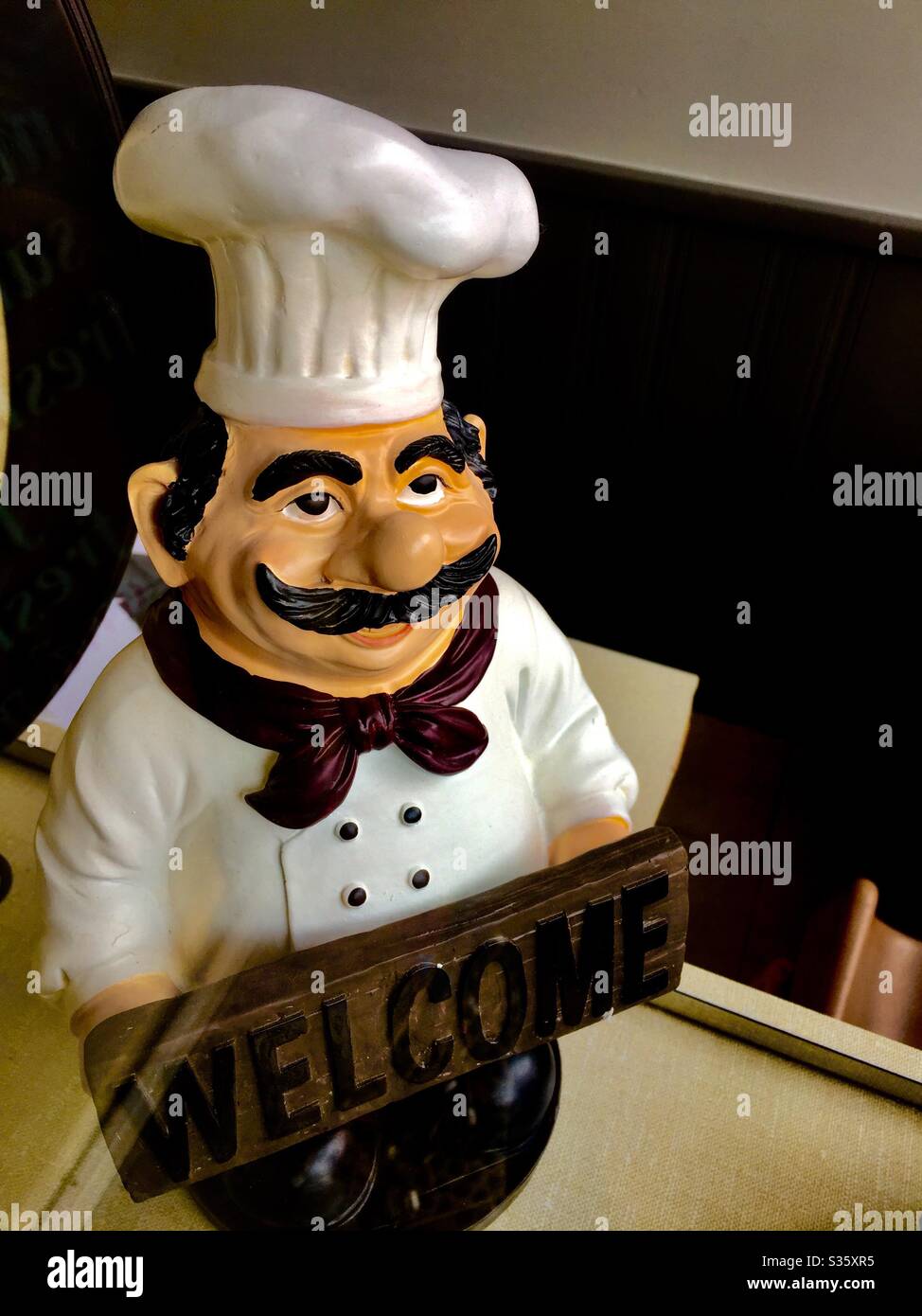 A smiling chef’s warm welcome, Ontario, Canada. Come on in. Well dressed. Well fed. Perfect icon for good eating. Fine food. Gourmet dining. - Smartphone Captured Stock Image