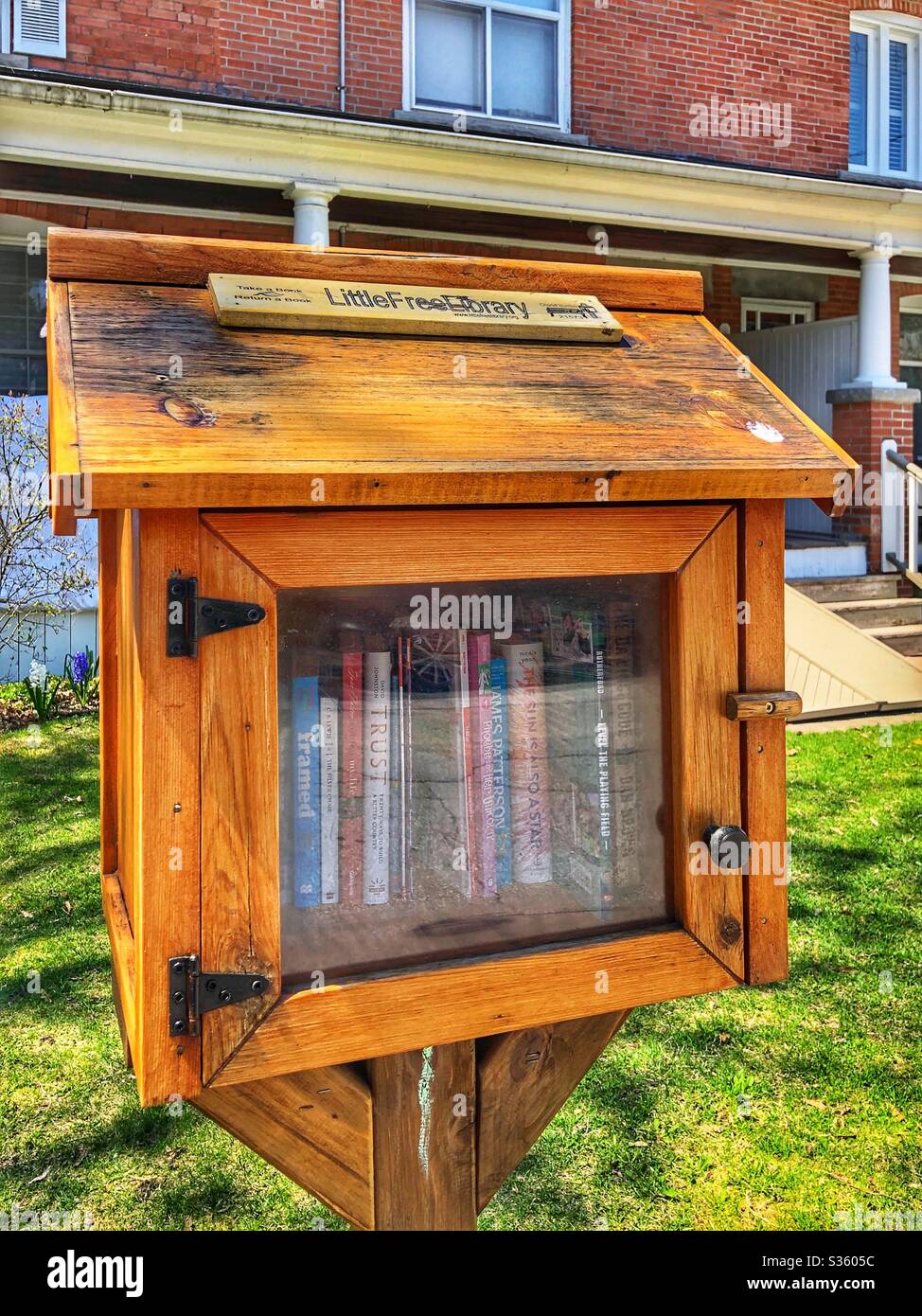 Little free library in a Toronto neighbourhood. - Smartphone Captured Stock Image