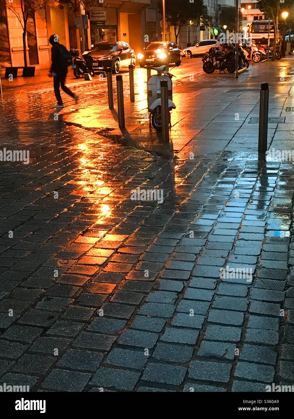 Reflections on wet pavement. Night view. - Smartphone Captured Stock Image
