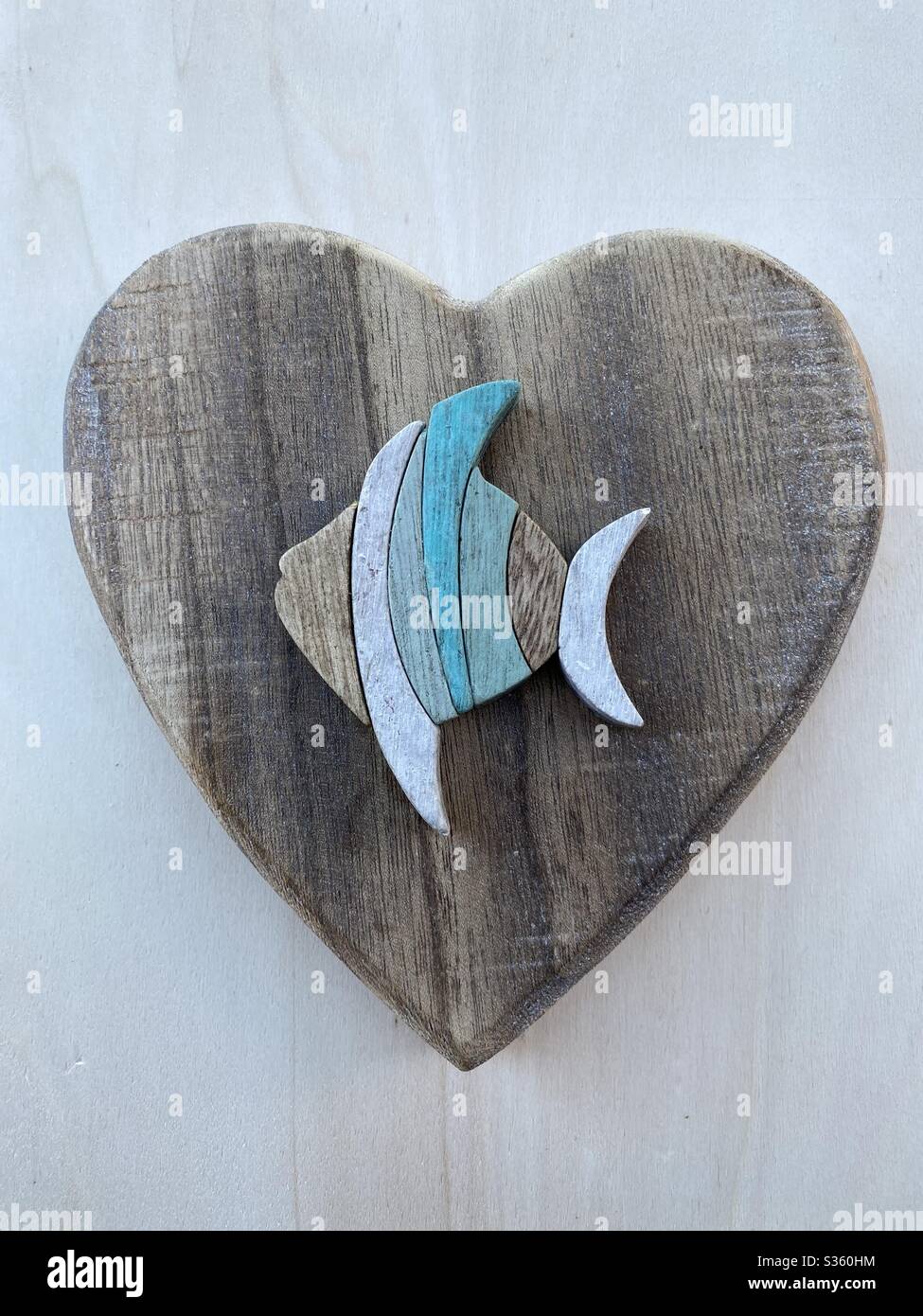 Creative fish restaurant sign with wooden objects - Smartphone Captured Stock Image