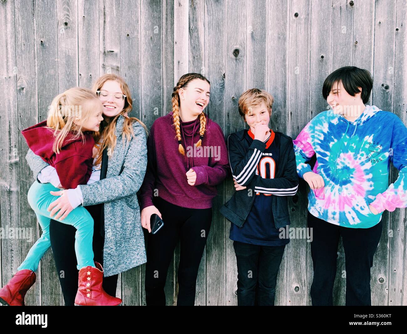Blended family of kids of all ages - Smartphone Captured Stock Image