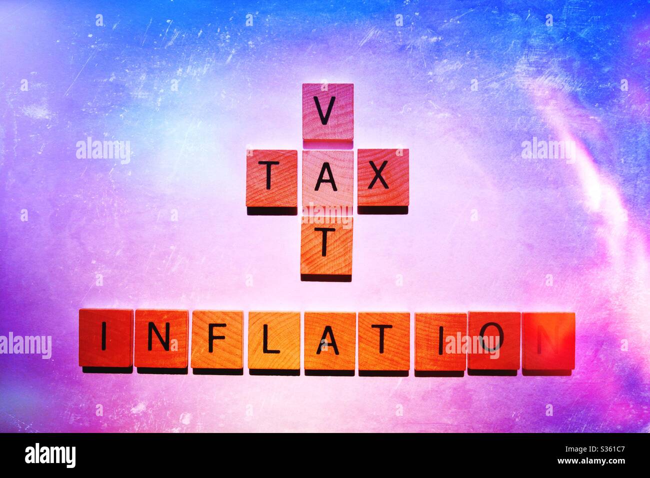 VAT and Tax crossword, above the word Inflation. Creative concept , business, finance and economy Stock Photo