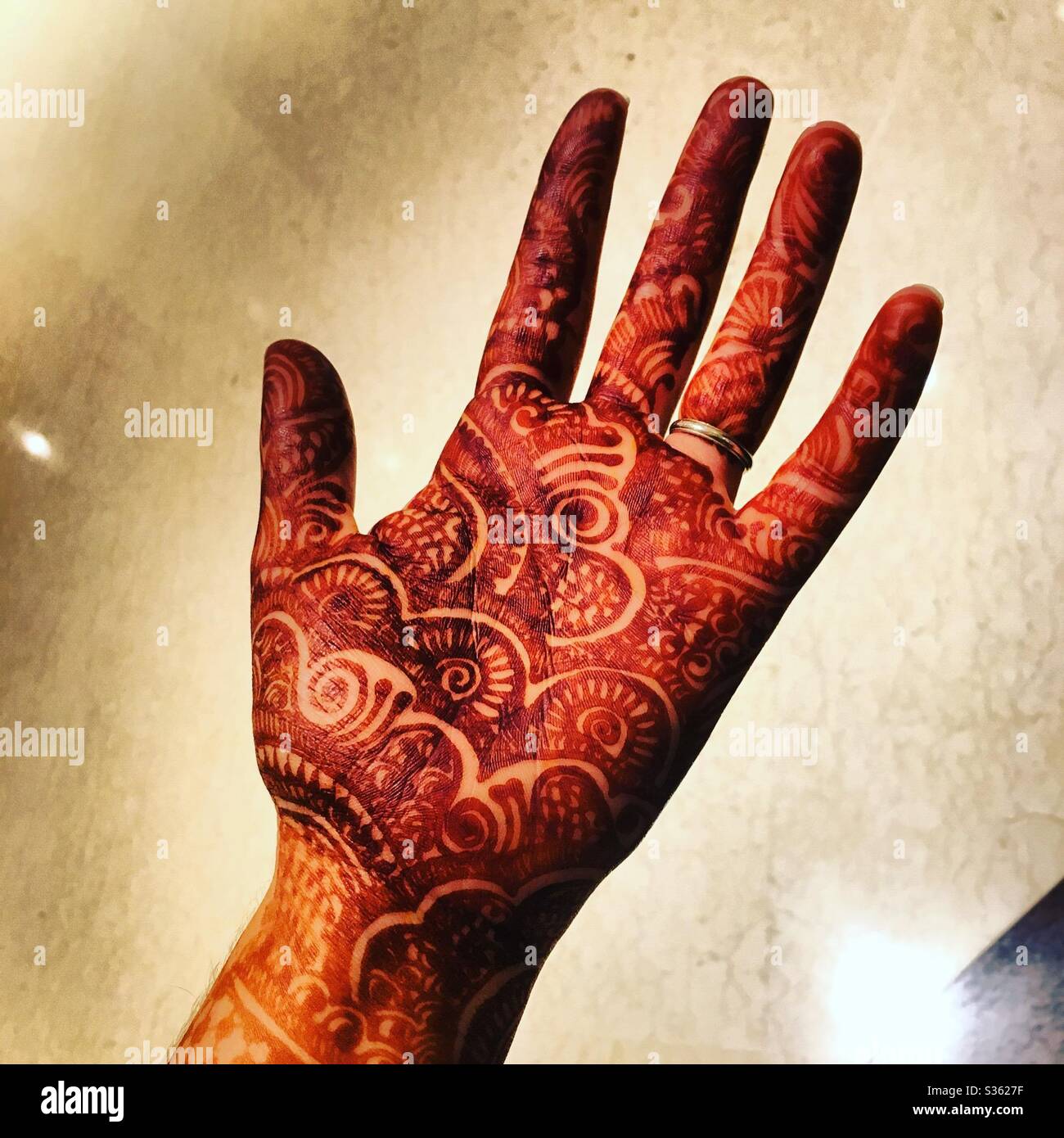 Henna tattoo on hand - Smartphone Captured Stock Image