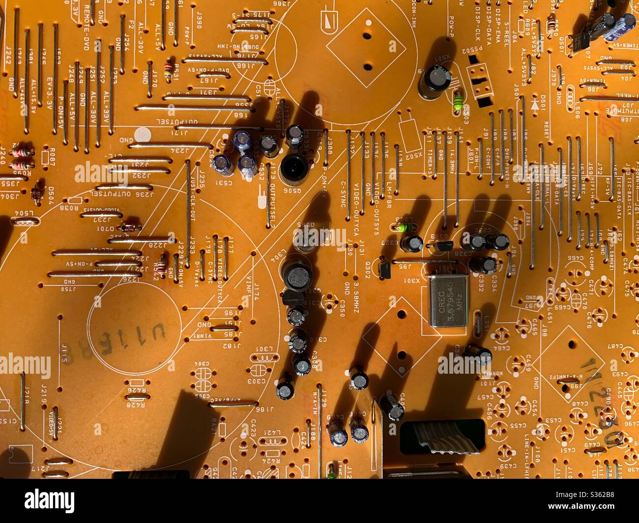 Orange motherboard, computer technology and data processing center Stock Photo