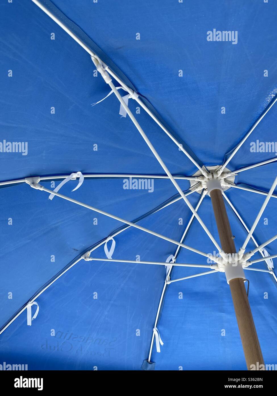 Underside of a blue beach umbrella - Smartphone Captured Stock Image