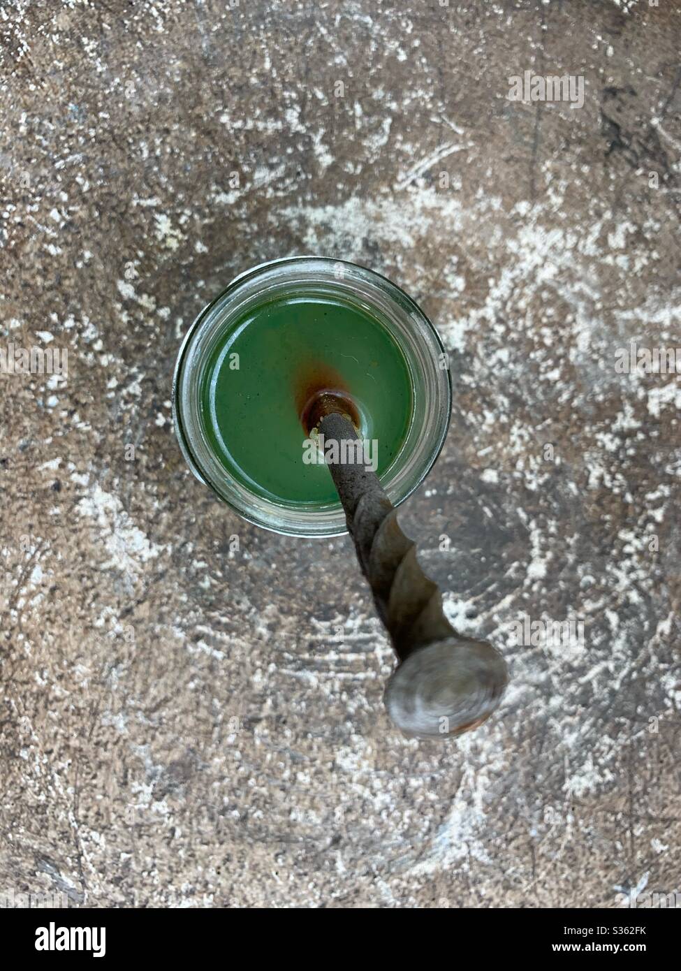 Scientific experiment of placing an iron nail in a solution of copper sulfate. Stock Photo