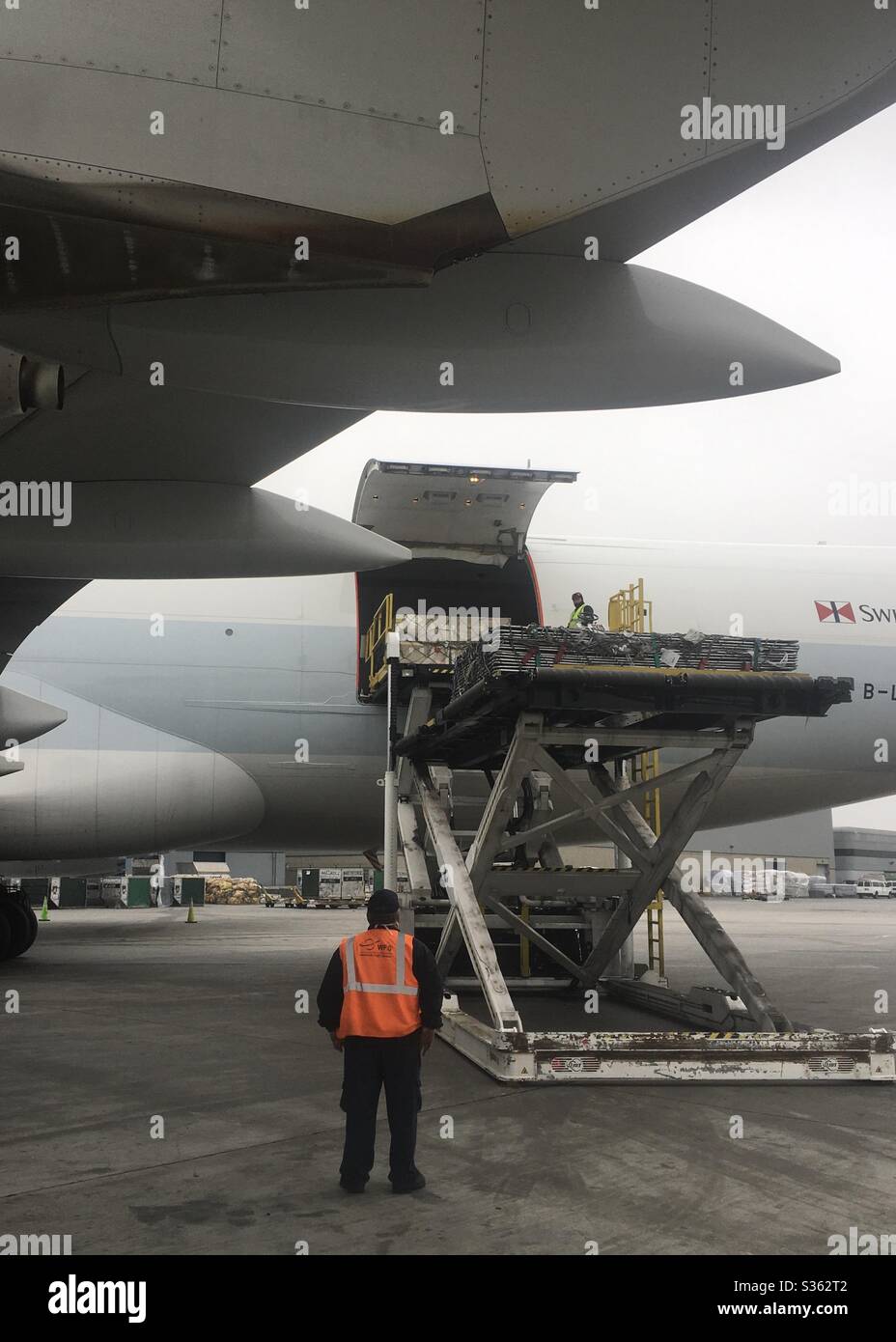 Loading Cargo into a Cathay Pacific 747-800 Freighter Stock Photo