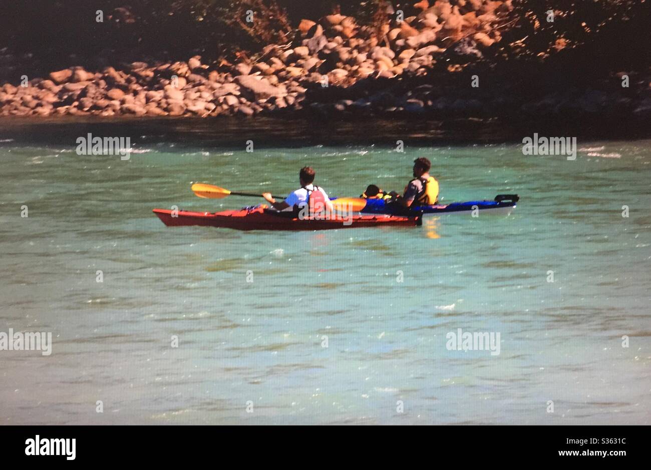 Two kayakers, Bow River, Calgary, Alberta, Canada - Smartphone Captured Stock Image