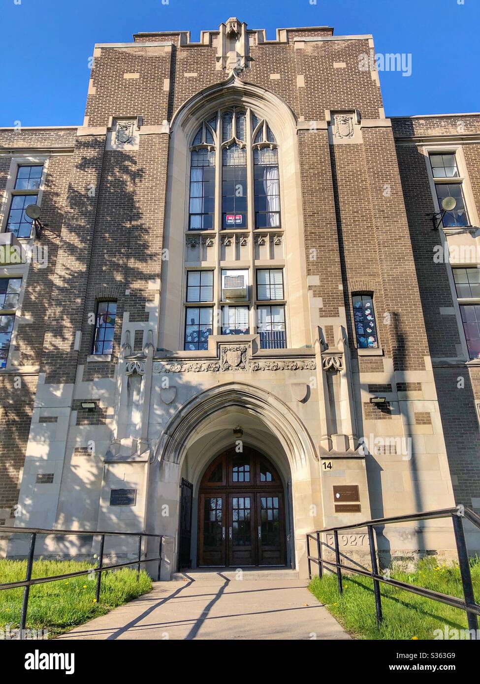 The entrance of a high school in a Toronto neighbourhood. - Smartphone Captured Stock Image