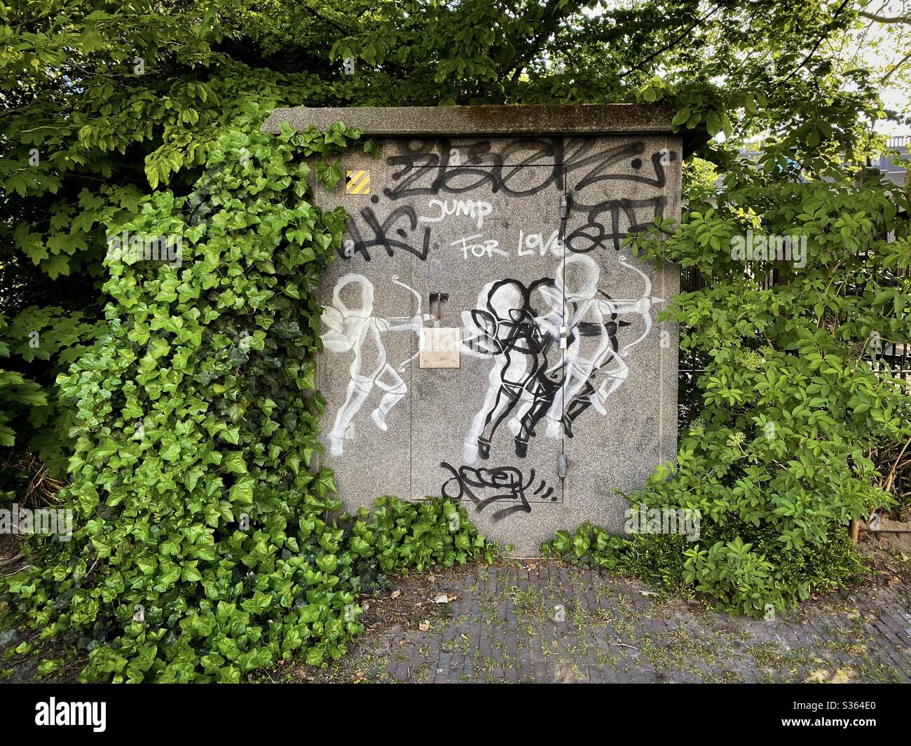 Jump for love. Graffiti with a Cupido like figure. - Smartphone Captured Stock Image