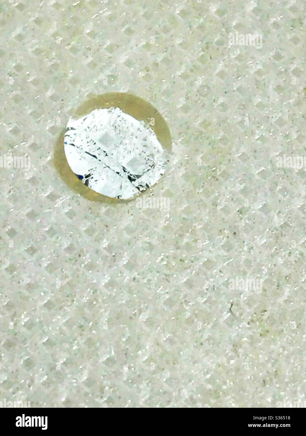 Drop of water on paper tablecloth - Smartphone Captured Stock Image