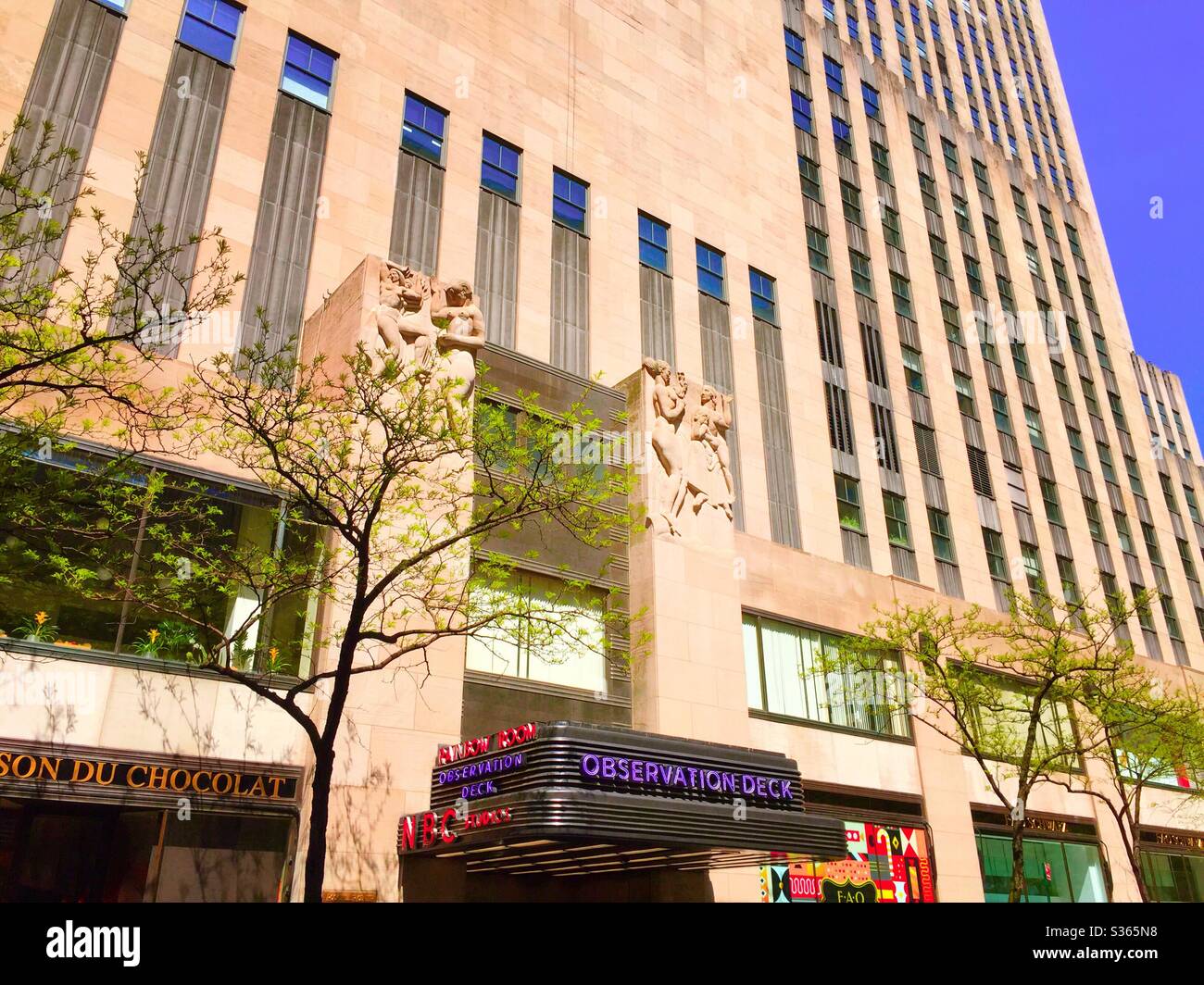 30 rock office building in Rockefeller Center features NBC studios, observation deck, NYC, USA - Smartphone Captured Stock Image