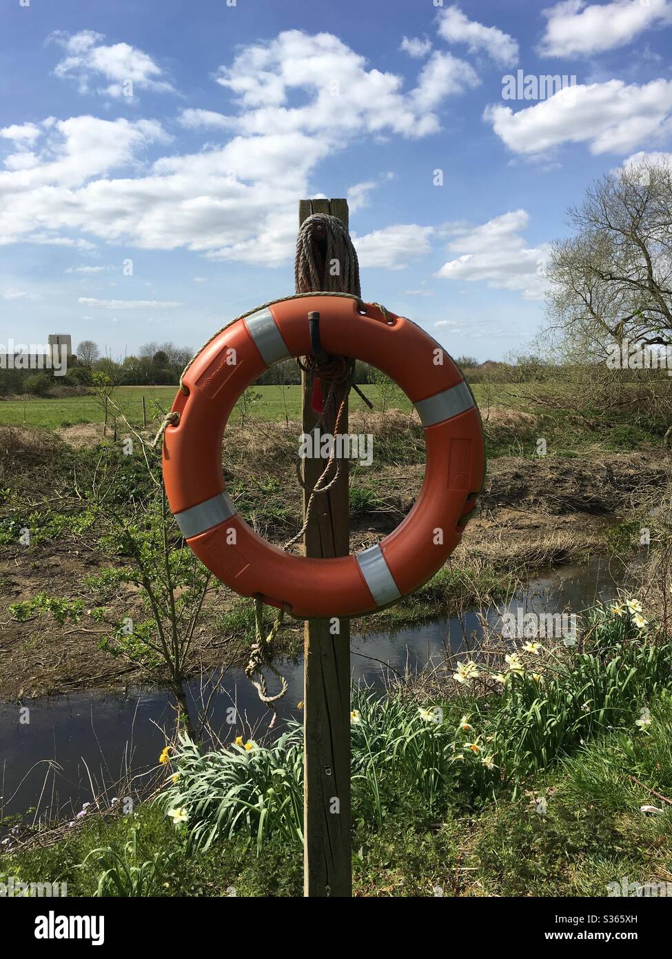 Lifebuoy / Life Ring on post by river Stock Photo