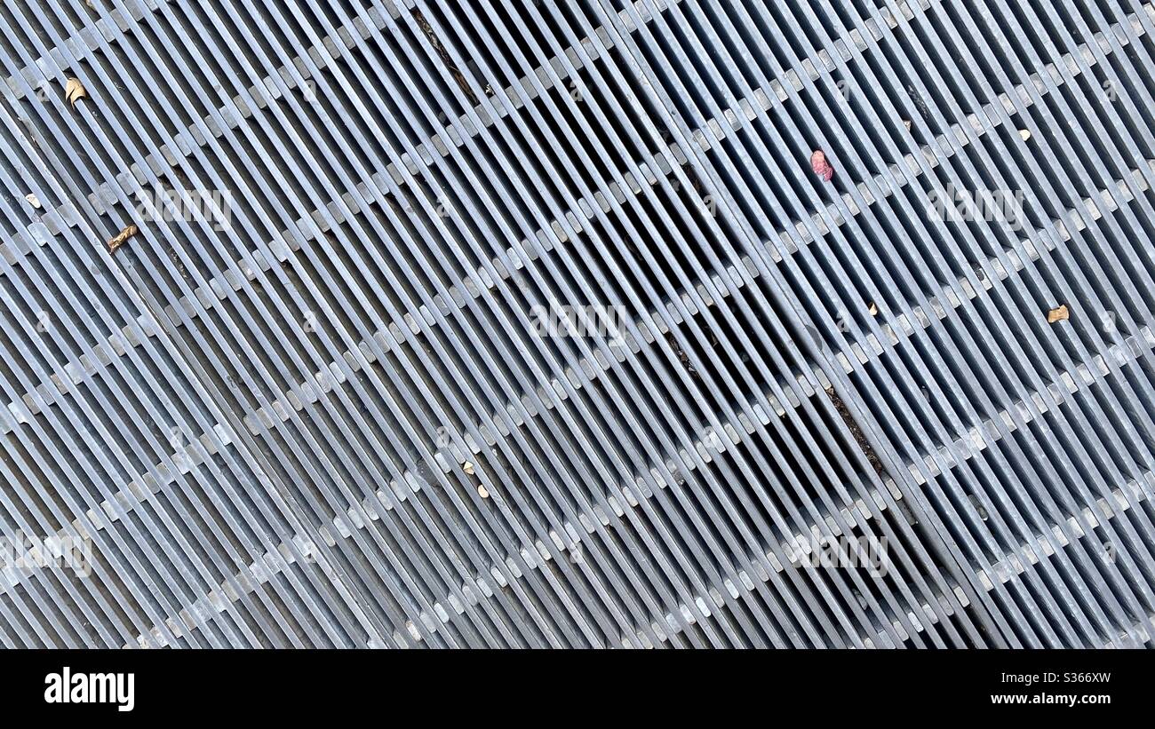 Metal floor grating, abstract pattern, suitable for use as background with text and graphics - Smartphone Captured Stock Image