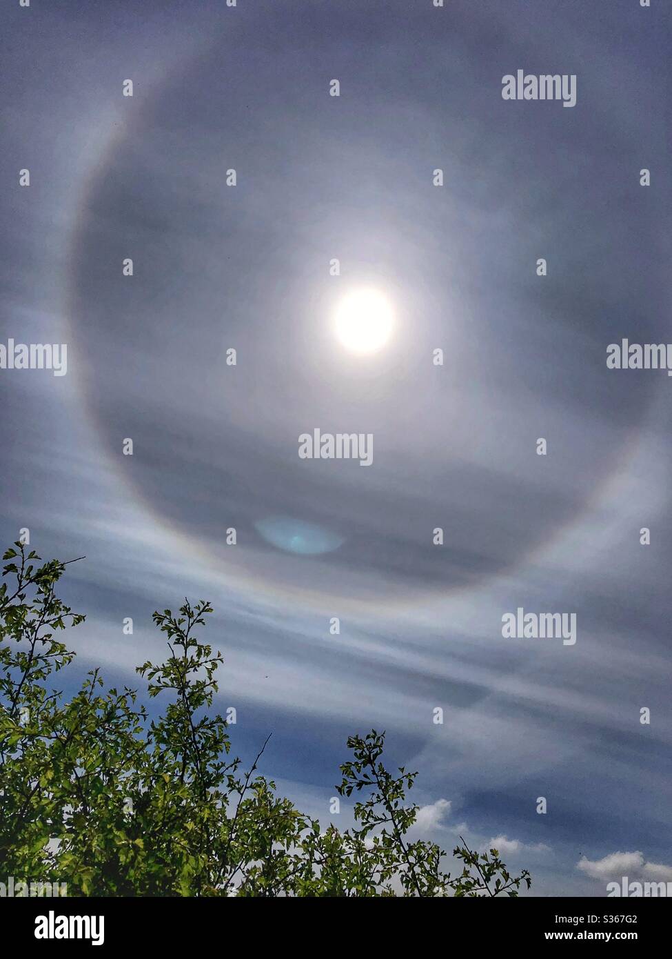 Rainbow halo around the sun on Otley Chevin West Yorkshire Stock Photo