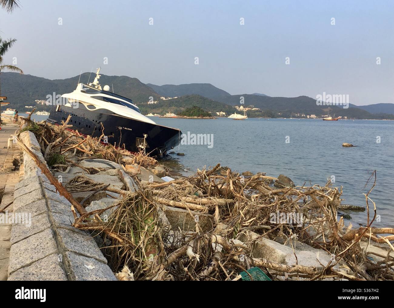 Super yacht washed ashore during typhoon Mangkhut in Sai Kung, Hong Kong, 2018. - Smartphone Captured Stock Image