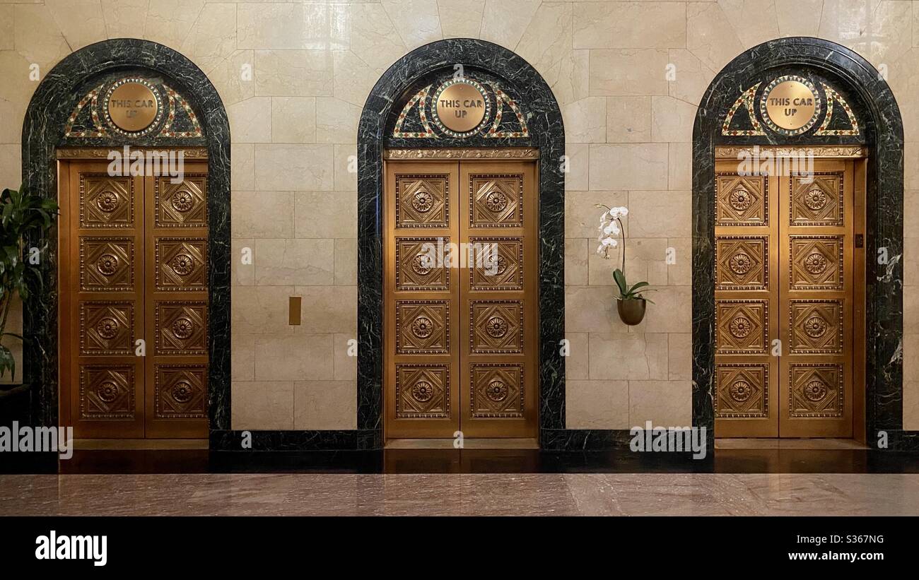 LOS ANGELES, CA, APR 2020 ornate elevator doors in marble lobby of