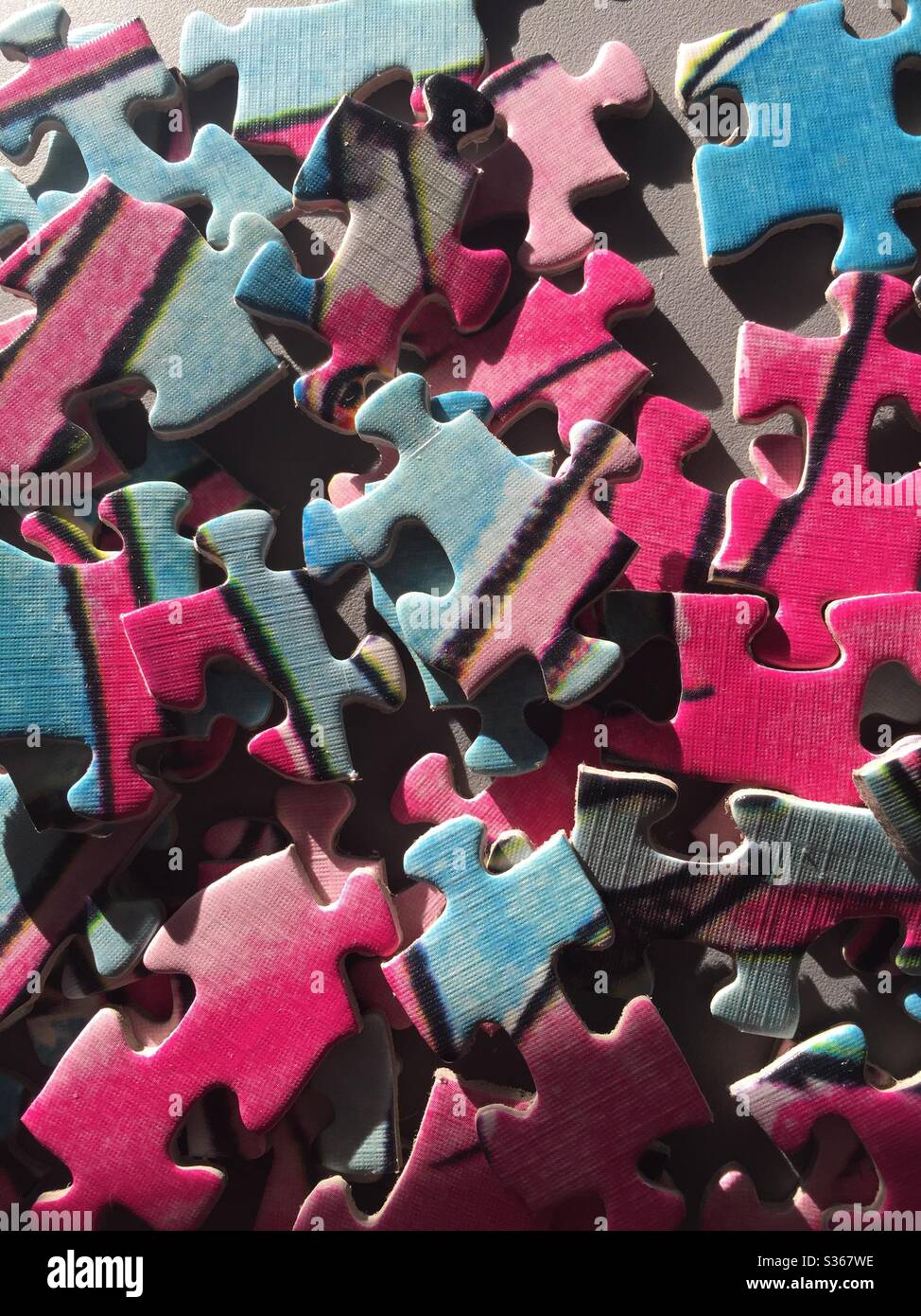 Jigsaw puzzle pieces close up unassembled Stock Photo