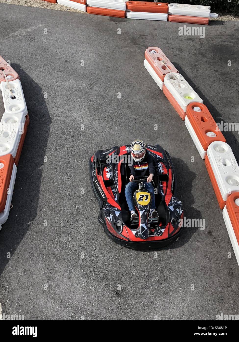 Looking down on a Go kart leaving the track at the end of a race - Smartphone Captured Stock Image