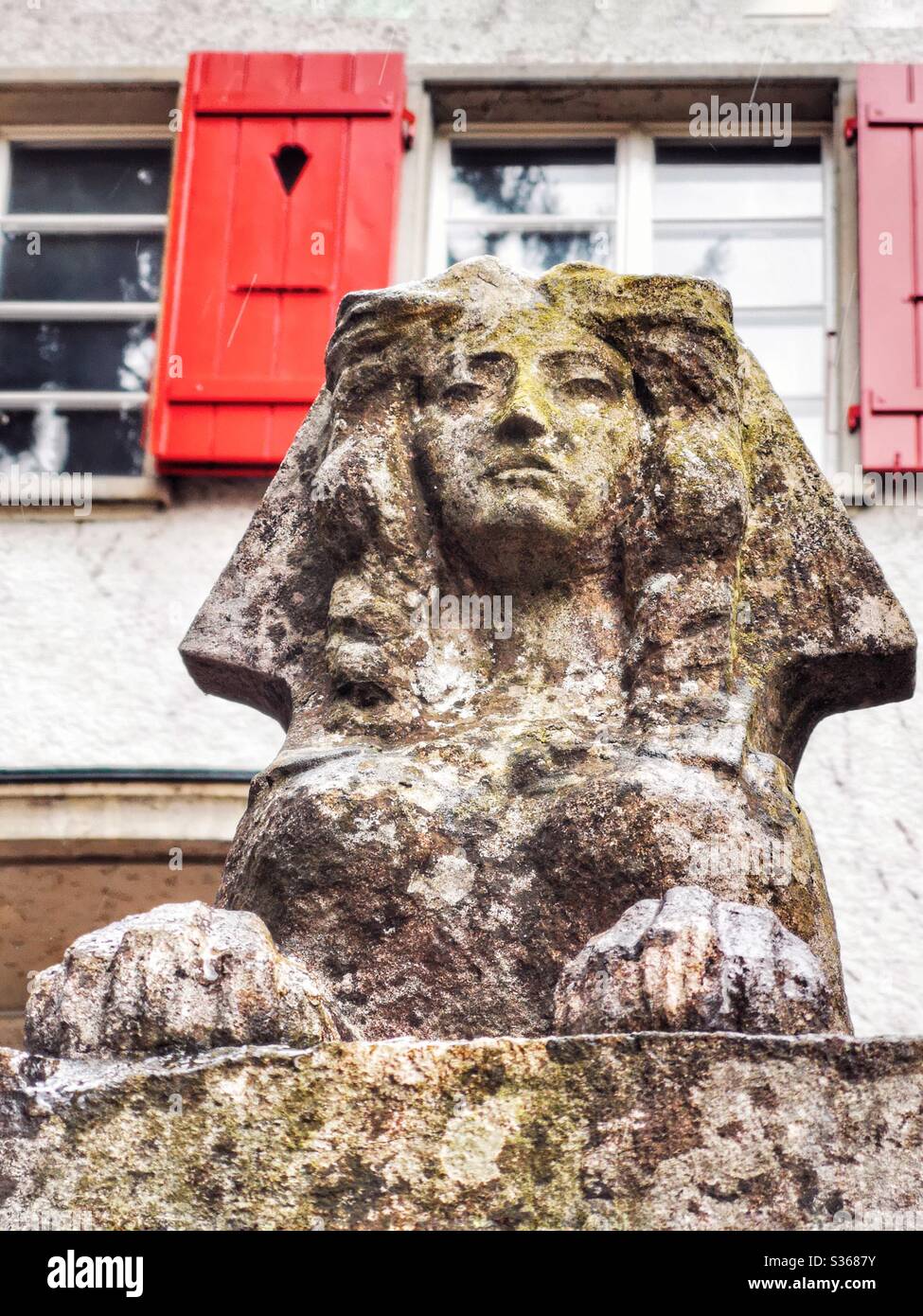 Sphinx statue in front of house - Smartphone Captured Stock Image