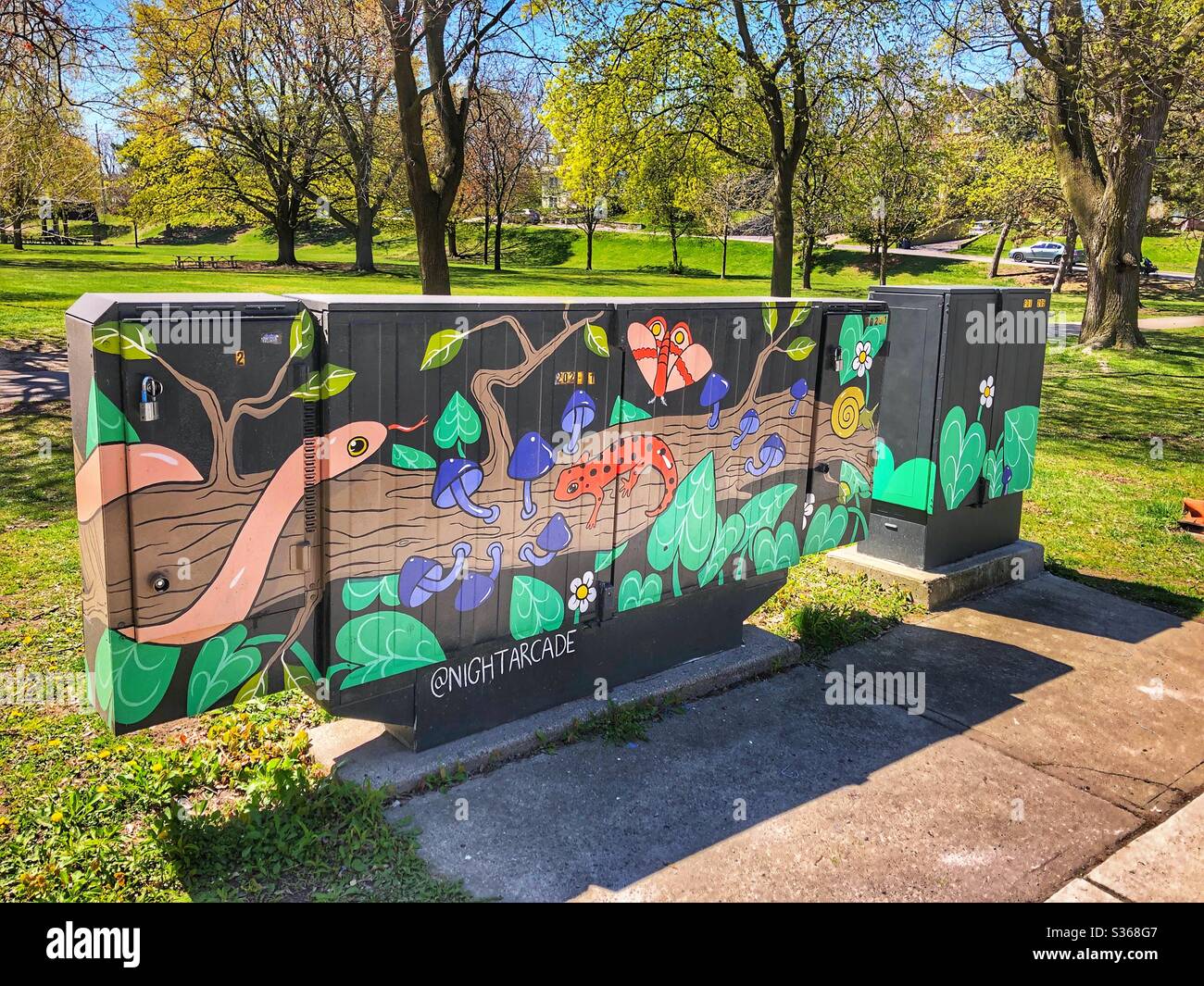 Colourfully painted utility boxes in a Toronto neighbourhood Stock