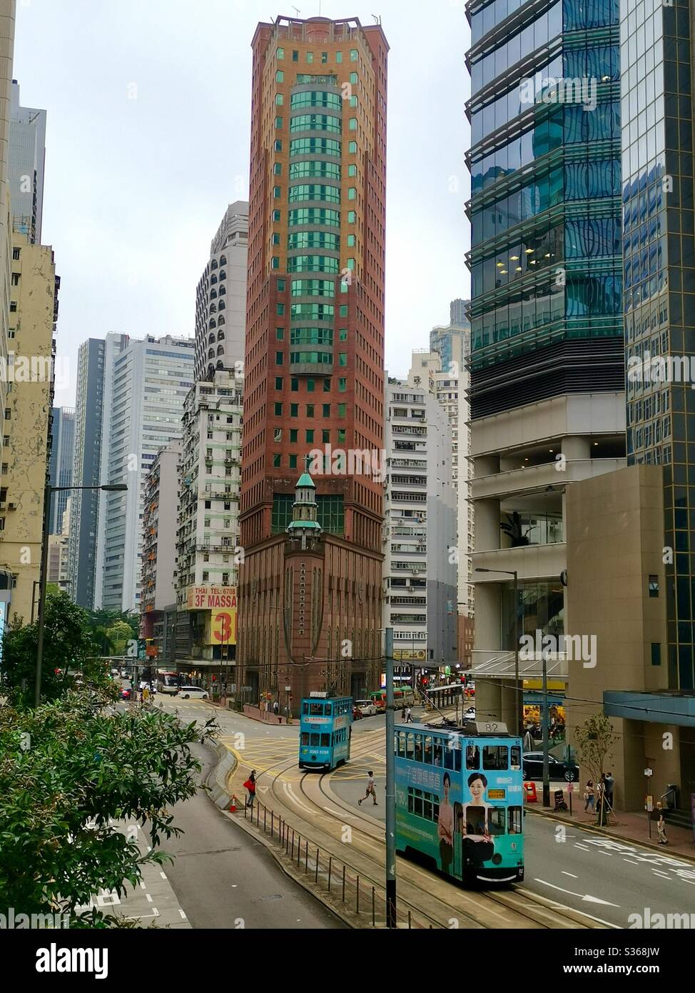 Trams by the Chinese Methodist church in Wan Chai, Hong Kong. - Smartphone Captured Stock Image