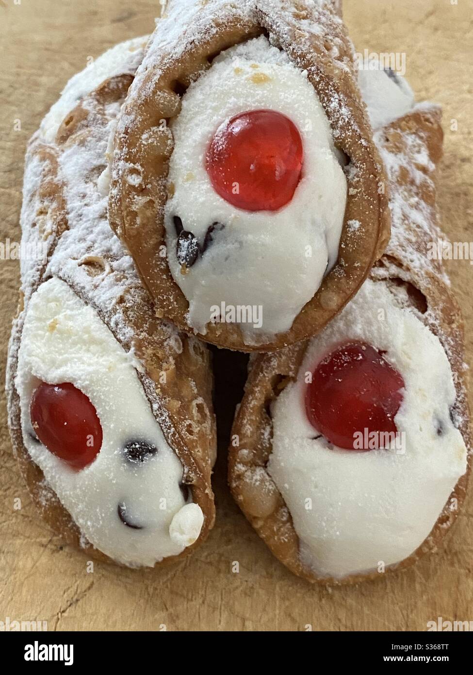 Closeup view over traditional Sicilian Cannoli, typical italian dessert with ricotta cheese Stock Photo