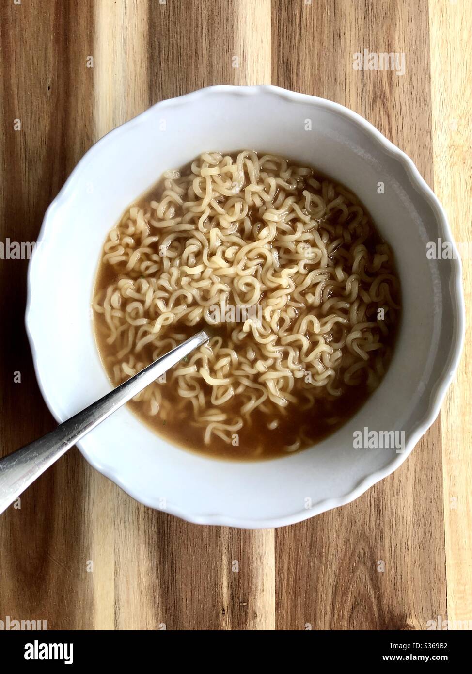 Ramen noodles in a white bowl - Smartphone Captured Stock Image