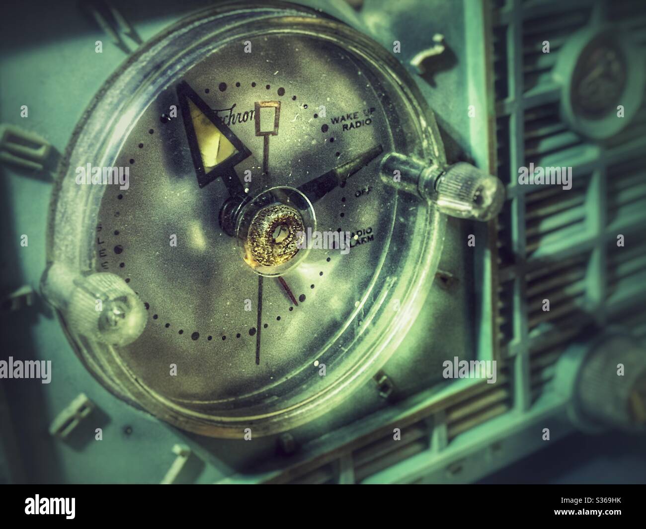 Closeup of a pale green vintage RCA clock radio clock face - Smartphone Captured Stock Image