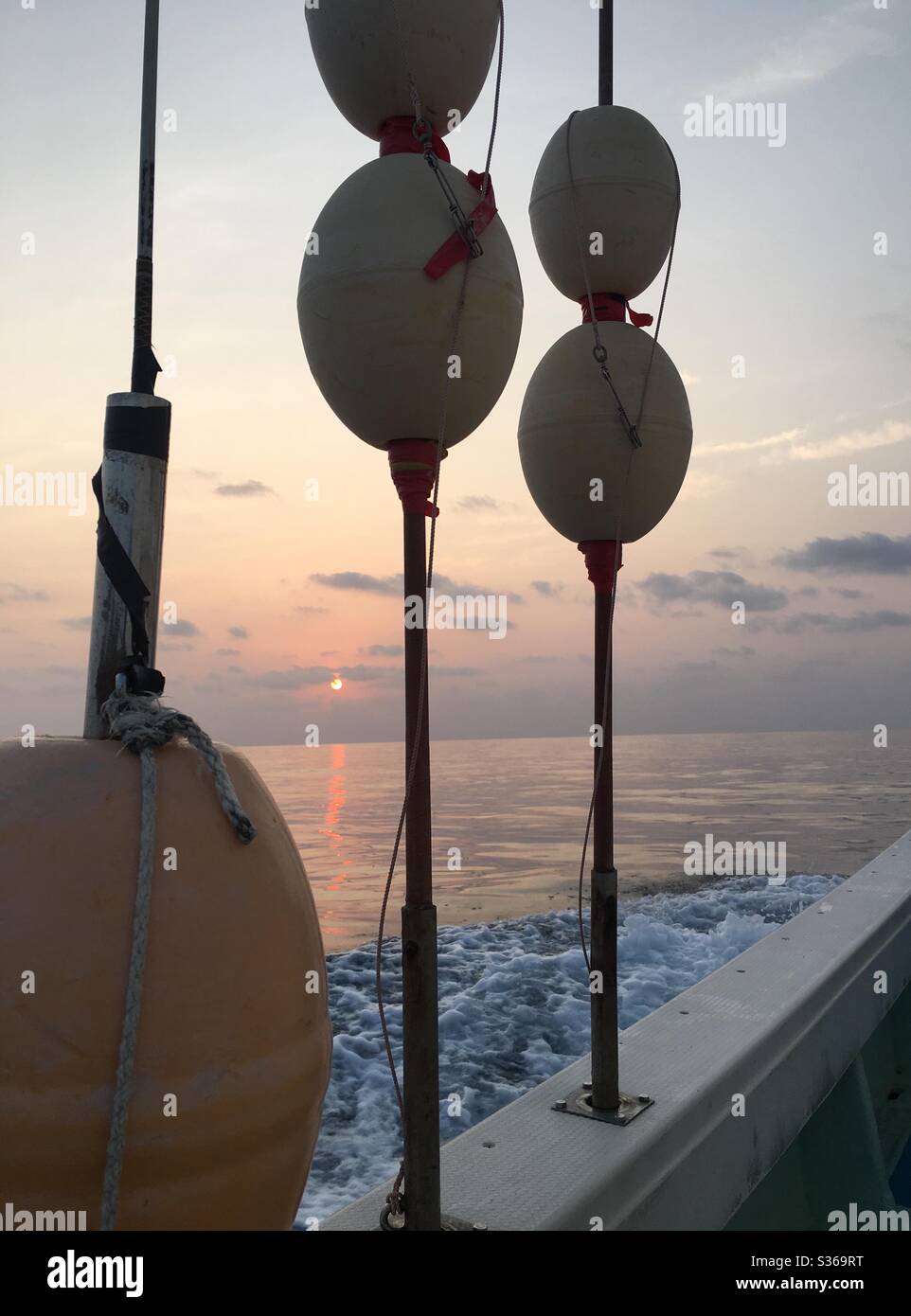 Sunrise on a deep sea fishing adventure in Okinawa Japan, Pacific Ocean side. Stock Photo