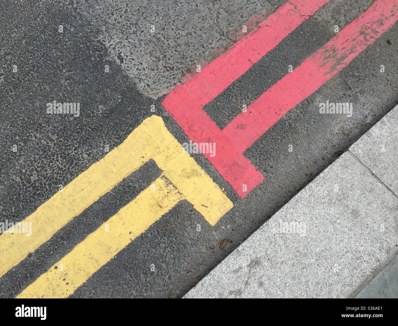 Double yellow lines meets “red route” in London UK - Smartphone Captured Stock Image