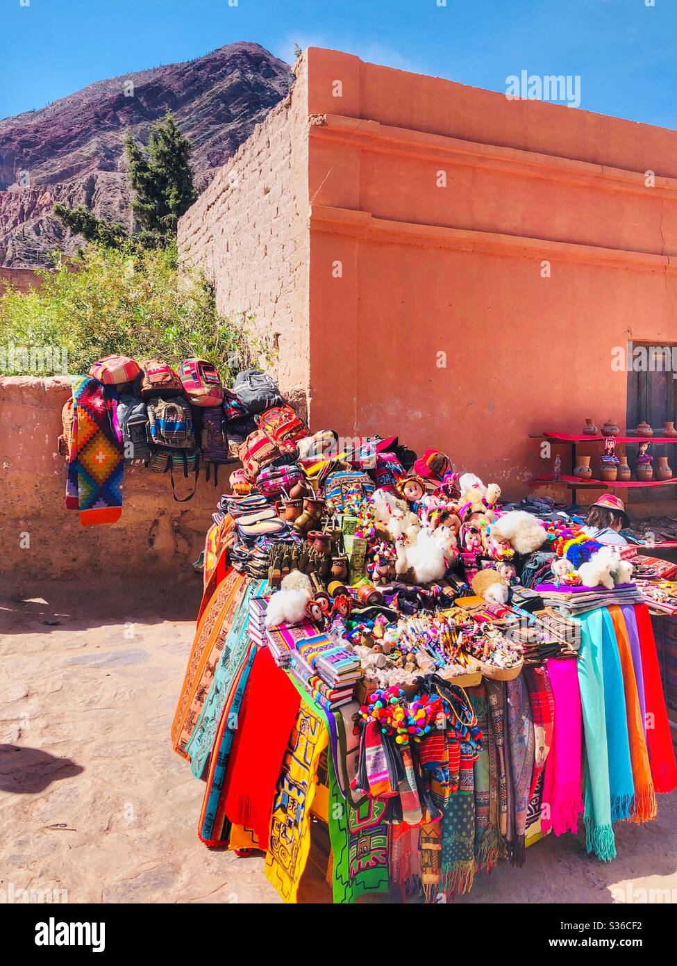 Colourful local handicrafts for sale in Purmamarca, a Unesco World Heritage Site in the desert landscape in Northern Argentina. Stock Photo