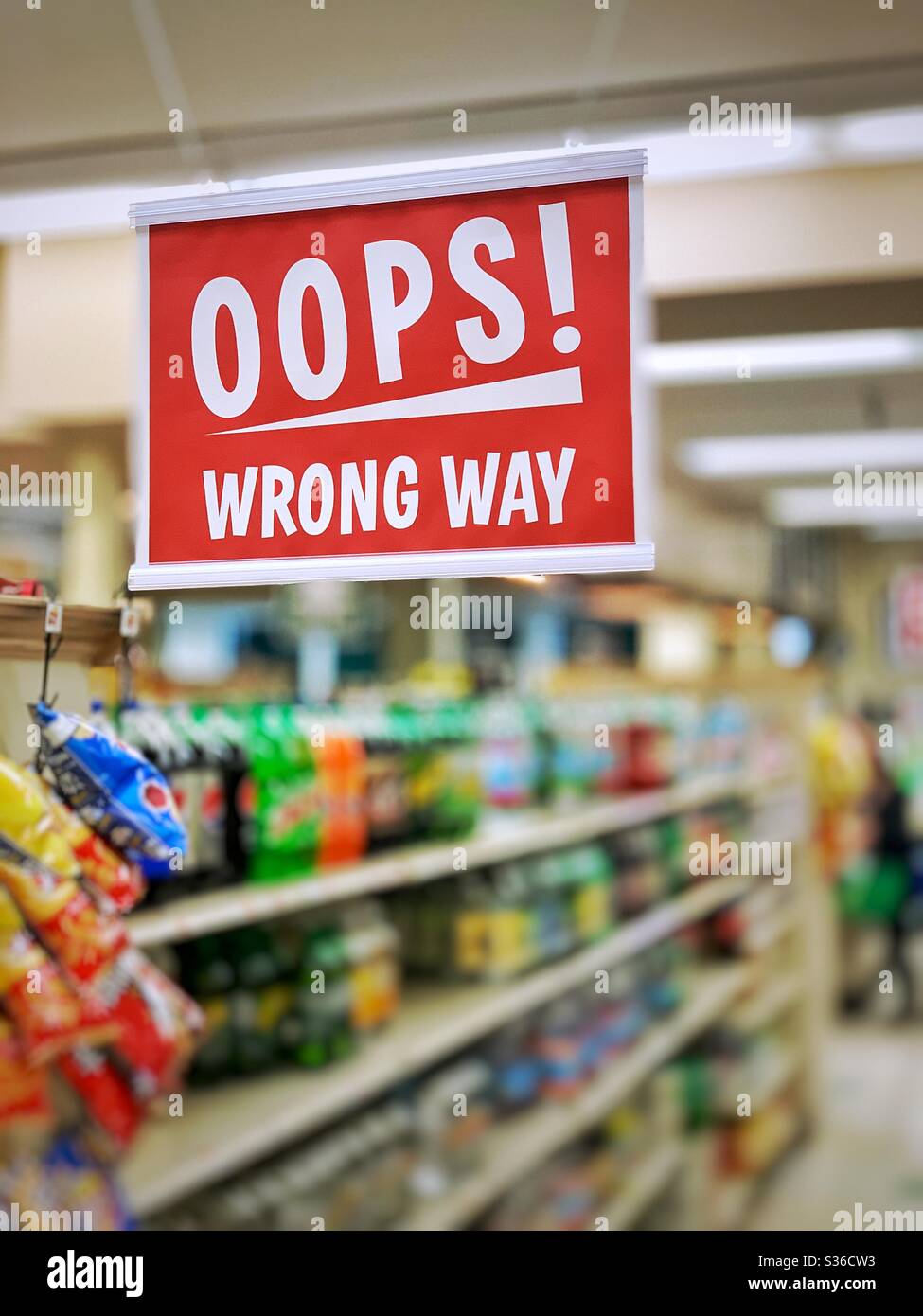 Oops wrong way sign in super market  for social distancing Stock Photo