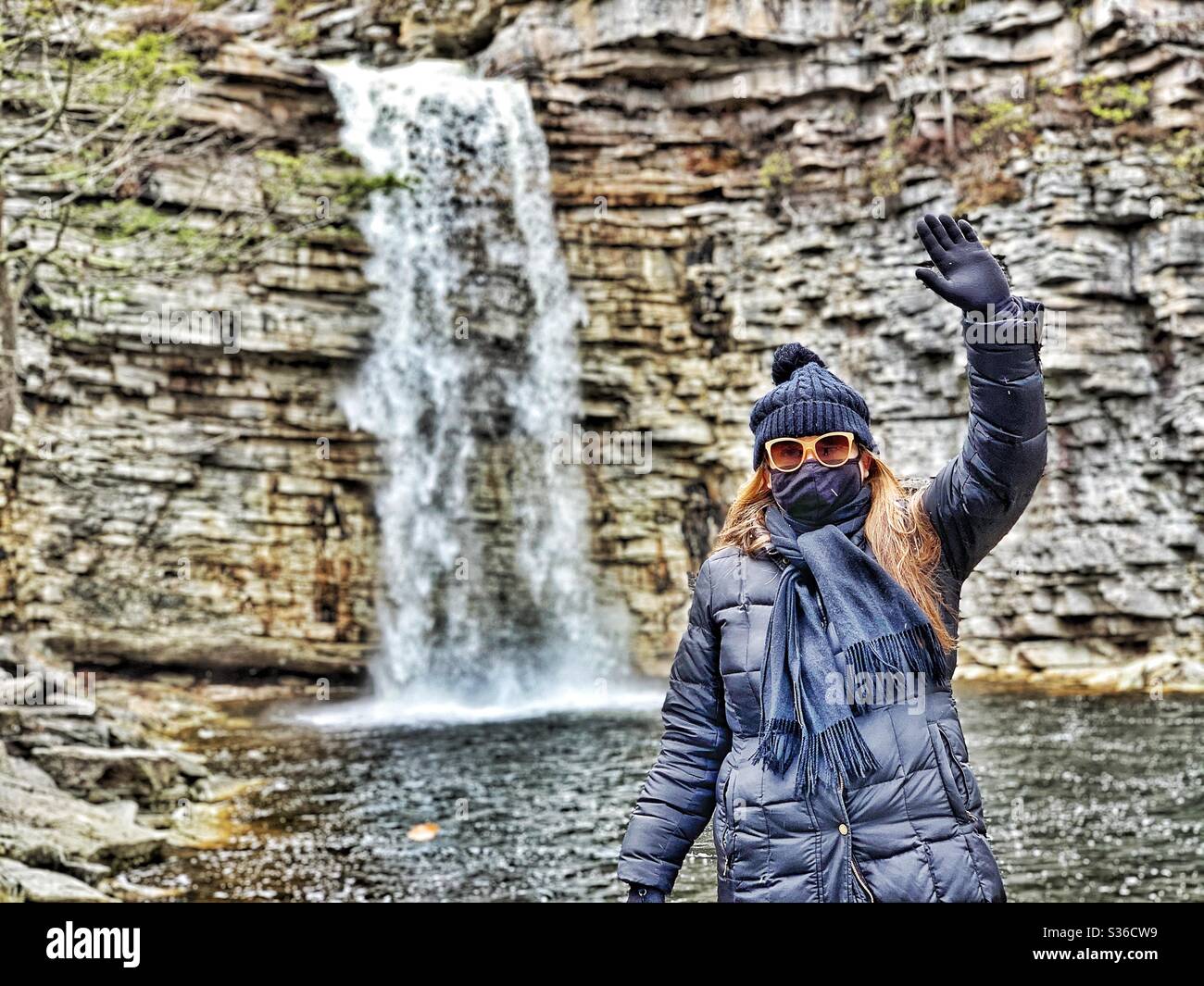 Woman enjoying a water in park with medical mask , social distancing - Smartphone Captured Stock Image