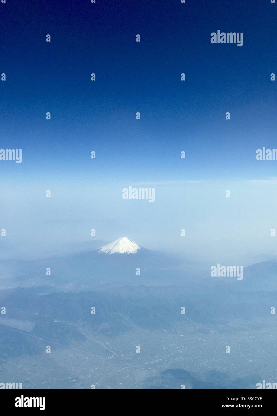 Mount Fuji in Japan, partially covered in snow in the spring time. - Smartphone Captured Stock Image