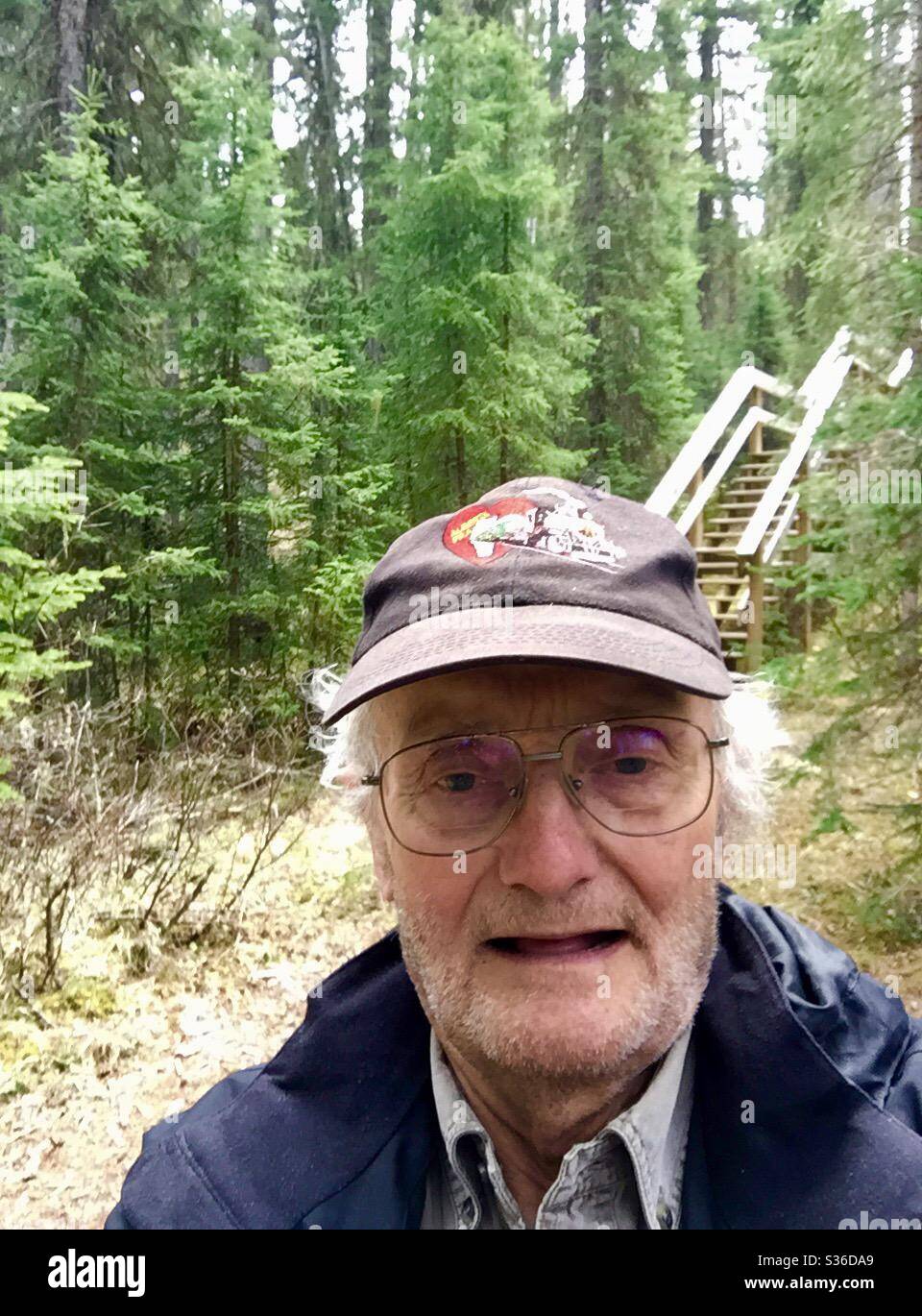 Senior hiker in William Dugnal Wilderness Park, Silver Creek, Skunk Hollow, coal mining, historic, wilderness, stream, River, Alberta, Canada, - Smartphone Captured Stock Image